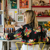 Louise Lockhart, the Yorkshire based illustrator and artist, in her art studio surrounded by her drawings and artwork.