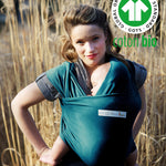 Adult carrying a baby in the Love Radius Organic Baby Wrap in Retro Blue. 