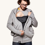 An adult wearing the Love Radius Parents Hoodie In Heather Grey, with a child inside showing the wrap-over chest cover. On a cream background