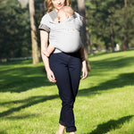 Adult carrying a baby in the Love Radius Organic Baby Wrap in Pearl. 