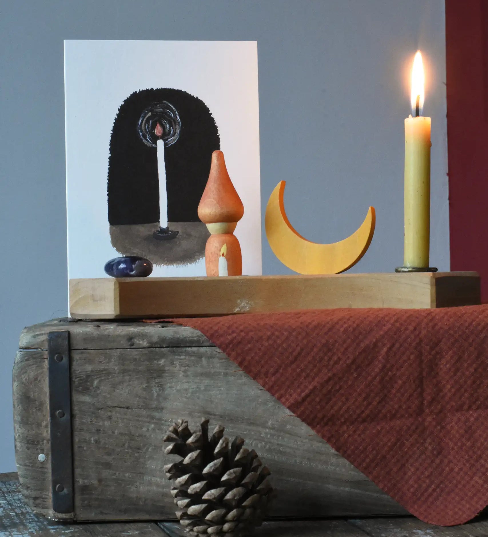 LydiaMae simple candle greetings card placed on a Grimm's celebration ring with Grapat Nins, moon and a lit candle.