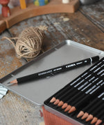 HB pencil from the Lyra 12 drawing pencils in sizes from 6B to 4H in a metal storage tin.