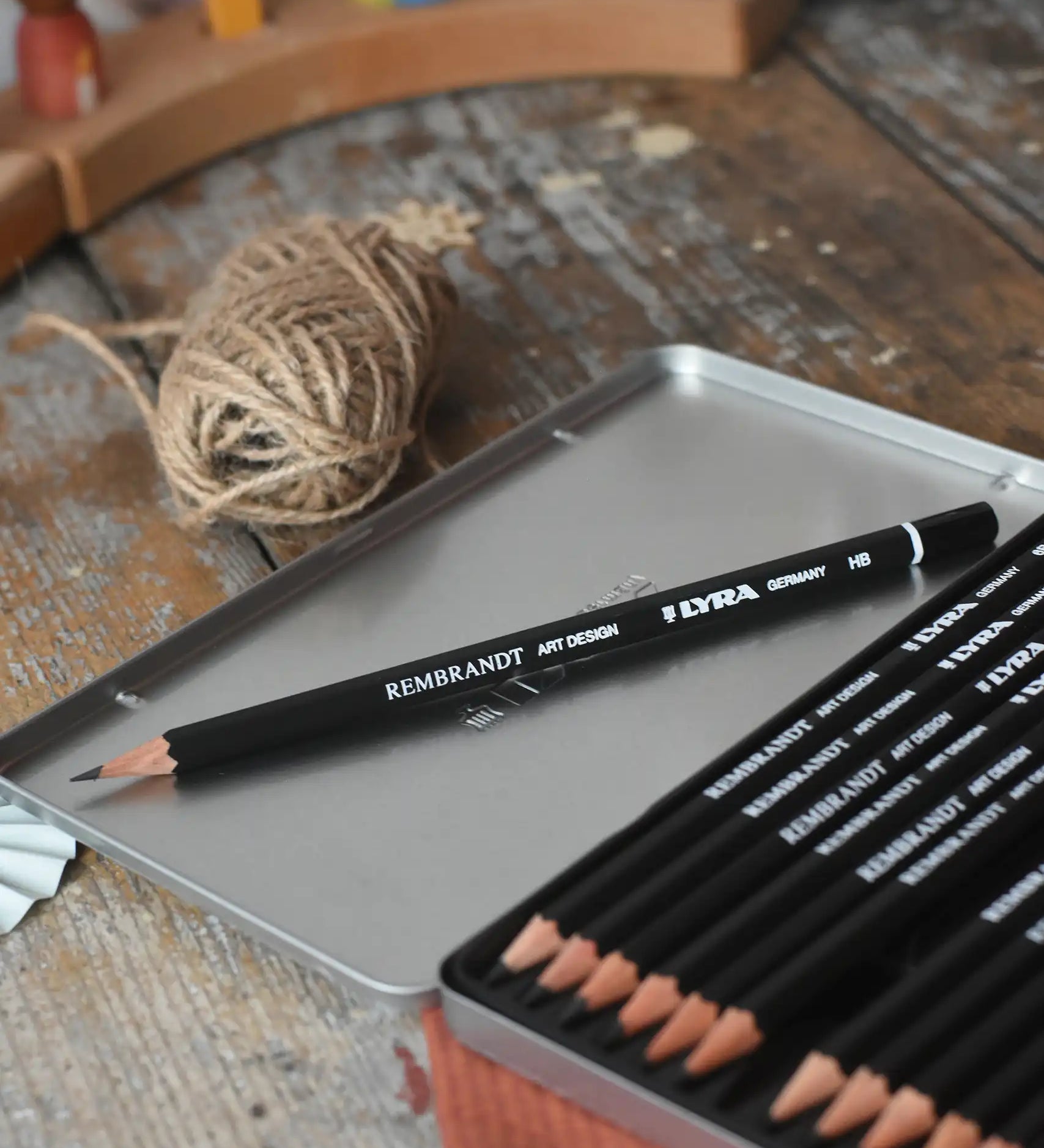 HB pencil from the Lyra 12 drawing pencils in sizes from 6B to 4H in a metal storage tin.