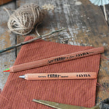 Lyra Ferby triangular shaped graphite HB pencil and rainbow 4 colour pencil placed on a desk.