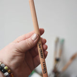 Light pink pencil from the Lyra 18 standard colour triangular Super Ferby pencil set in an adult's hand. 