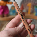 Lyra Ferby triangular shaped graphite HB pencil in an adult's hand.