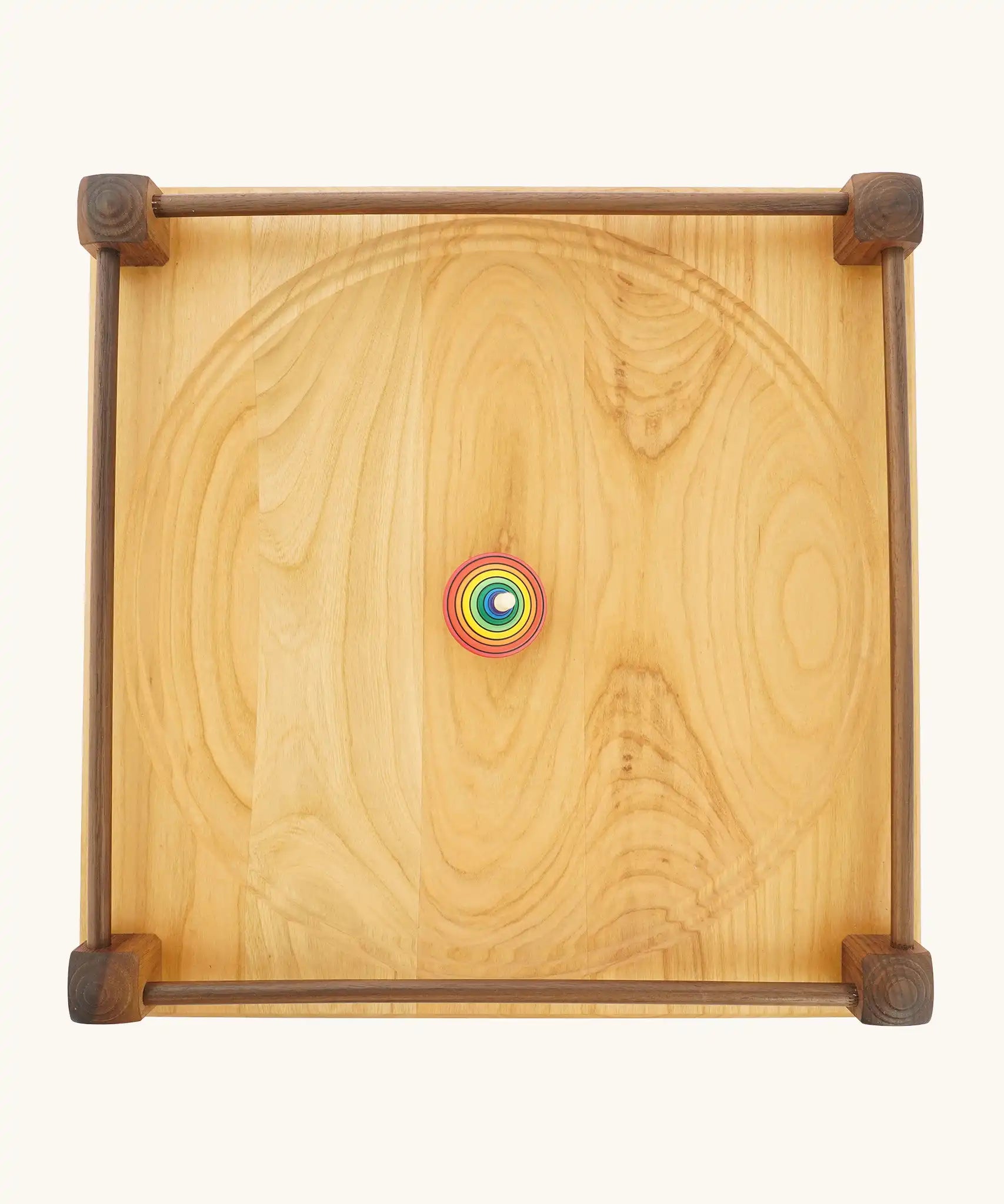 Mader Kreiselmanufaktur Manège wooden spinning plate. Overhead shot of rallye spinning top placed in the middle.