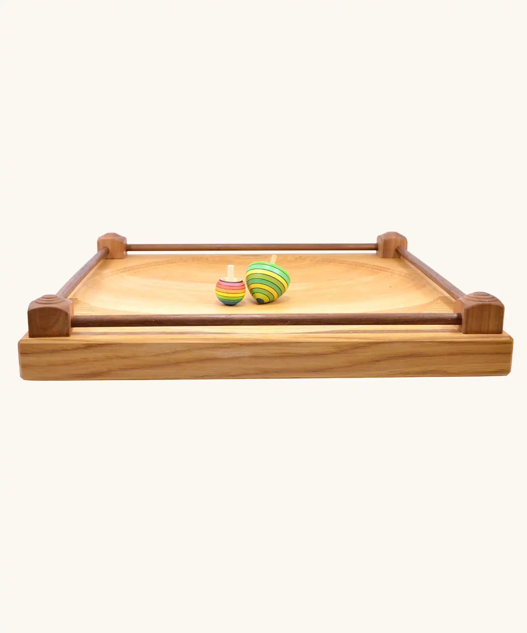 Side on view showing the walnut wood sides on the Mader Kreiselmanufaktur Manège wooden spinning plate.