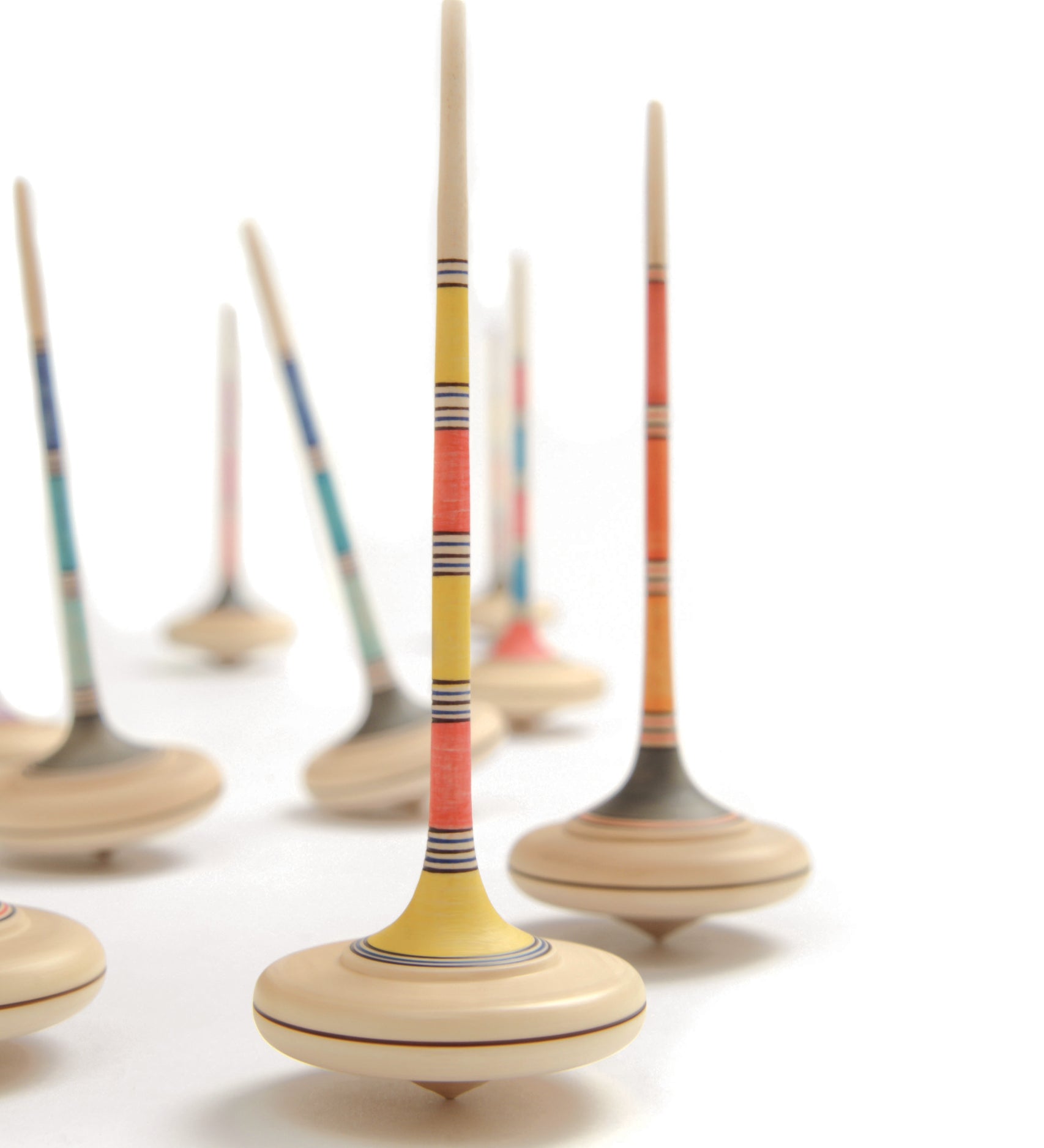 A collection of Mader Kreiselmanufaktur Large Arabella wooden Spinning Tops. A random colour selection will be chosen.