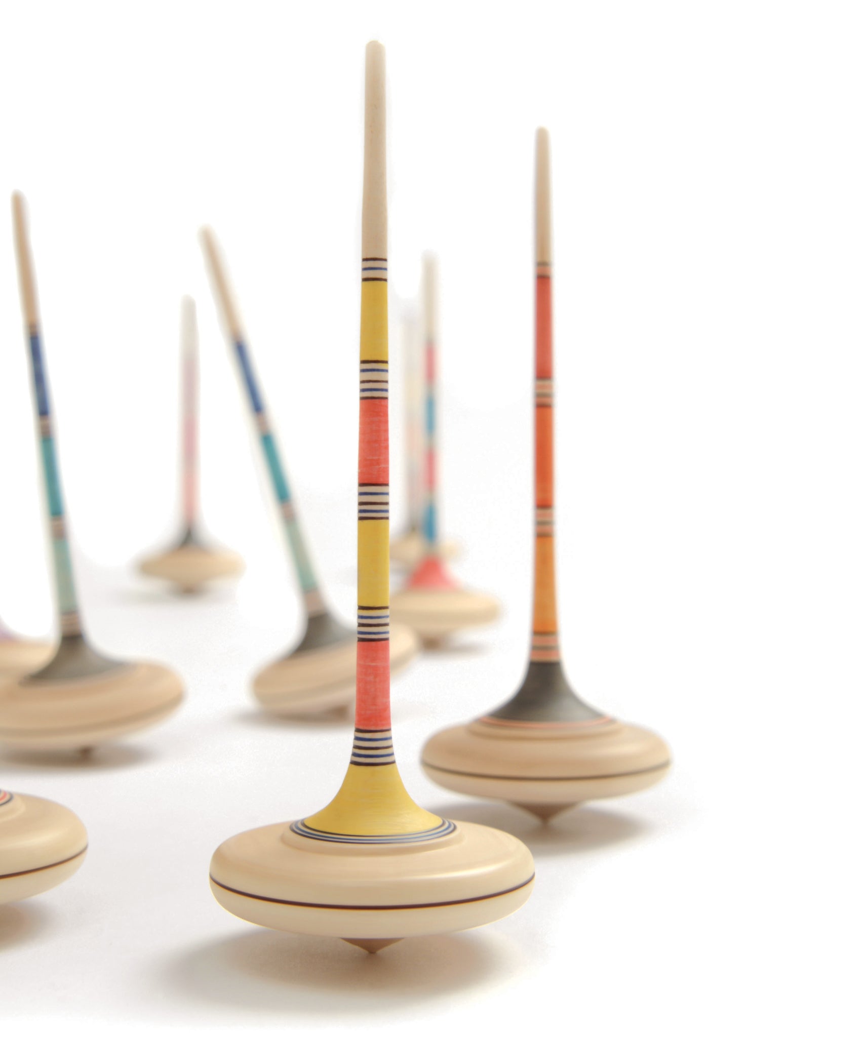 A collection of Mader Kreiselmanufaktur Large Arabella wooden Spinning Tops. A random colour selection will be chosen.