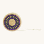 A wooden Mader Arabesk freewheel yo yo with a purple and blue trim design on  a cream background.