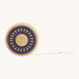 A wooden Mader Arabesk freewheel yo yo with a purple and blue trim design on  a cream background.