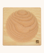 Mader handcrafted ash square medium spinning top plate. Showing the logo on the bottom corner