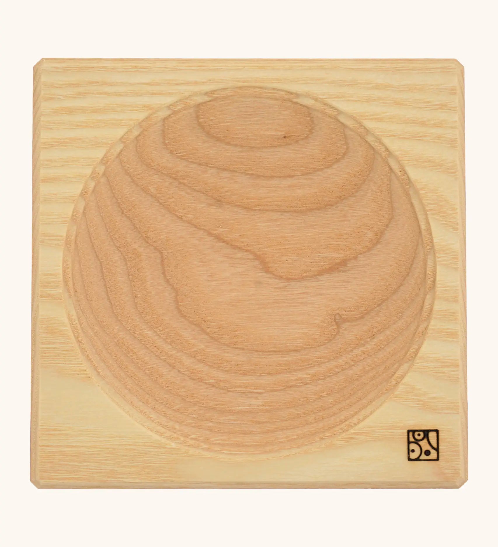 Mader handcrafted ash square medium spinning top plate. Showing the logo on the bottom corner