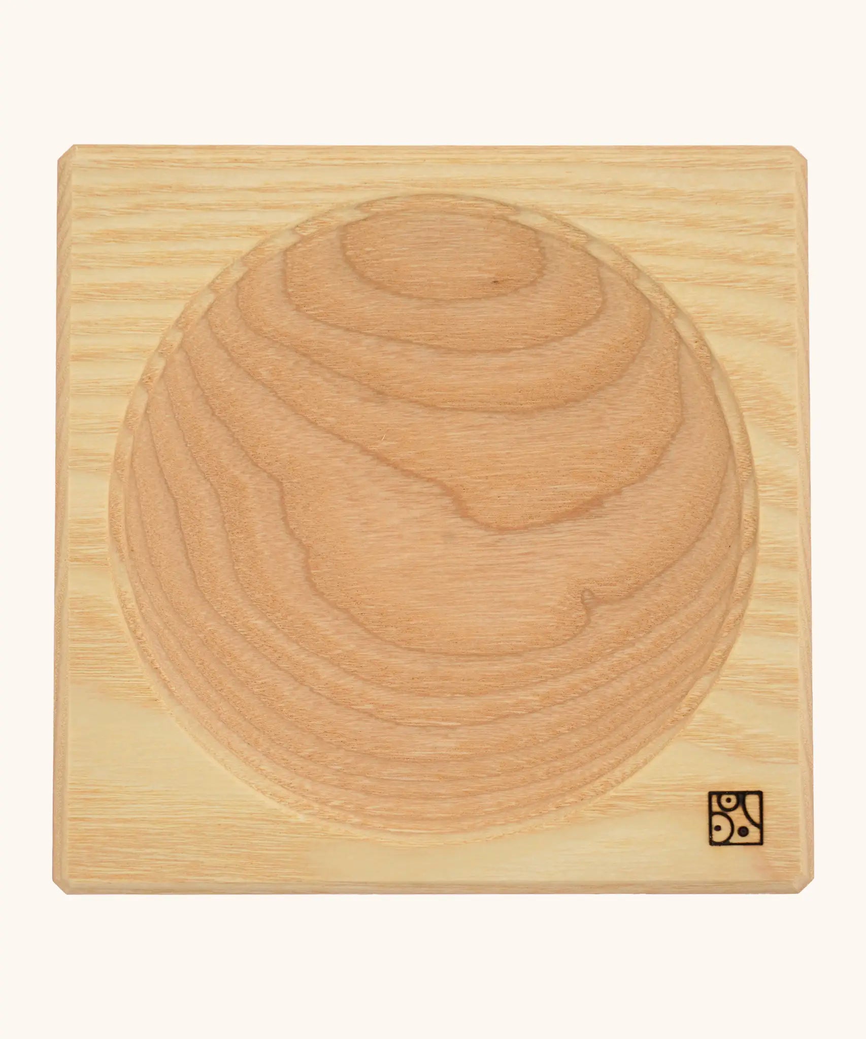 Mader handcrafted ash square medium spinning top plate. Showing the logo on the bottom corner
