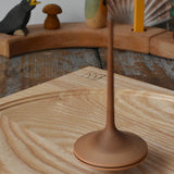 Mader ballerina wooden spinning top spinning in motion on an ash spinning plate in the Babipur playroom. 