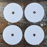Mader 4 Replacement Discs for 'So And So' Spinning Top Set placed on a wooden surface.