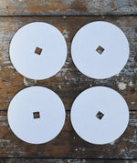 Mader 4 Replacement Discs for 'So And So' Spinning Top Set placed on a wooden surface.