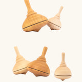 A collection of Mader classic spinning tops in various types of wood.