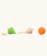Mader Kreiselmanufaktur Coloured Profi Throw Wooden Spinning Tops in  three different colours. Green, natural and orange.