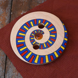 Mader Disc spinning Top Geometric placed on a wooden desk in the Babipur playroom.