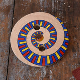 Mader Disc spinning Top Geometric placed on a wooden desk in the Babipur playroom.