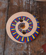 Mader Disc spinning Top Geometric placed on a wooden desk in the Babipur playroom.