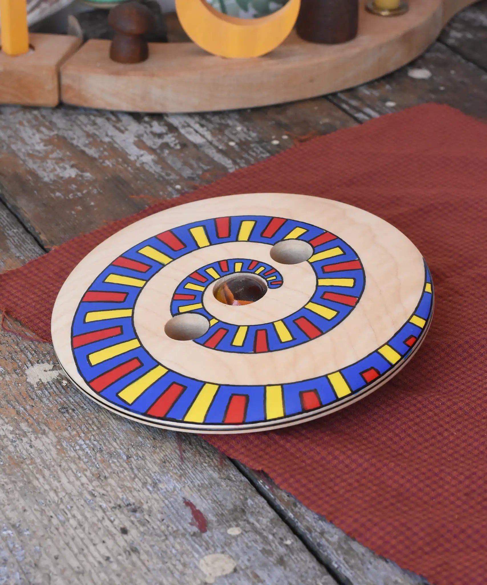 Mader Disc spinning Top Geometric placed on a wooden desk in the Babipur playroom.