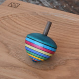 Mader dragon egg spinning top placed on an oak spinning plate in the Babipur playroom. 