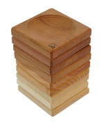 Stack of different colour Mader Mini plates on a white background