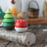 Close up of the side of the Mader forest spinning top set. 