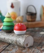 Close up of the side of the Mader forest spinning top set. 