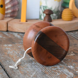 Mader free wheel butterfly yoyo placed on a wooden surface in the Babipur playroom. 