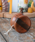 Mader free wheel butterfly yoyo placed on a wooden surface in the Babipur playroom. 