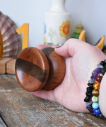 Mader free wheel butterfly yoyo placed in an adult hand. 