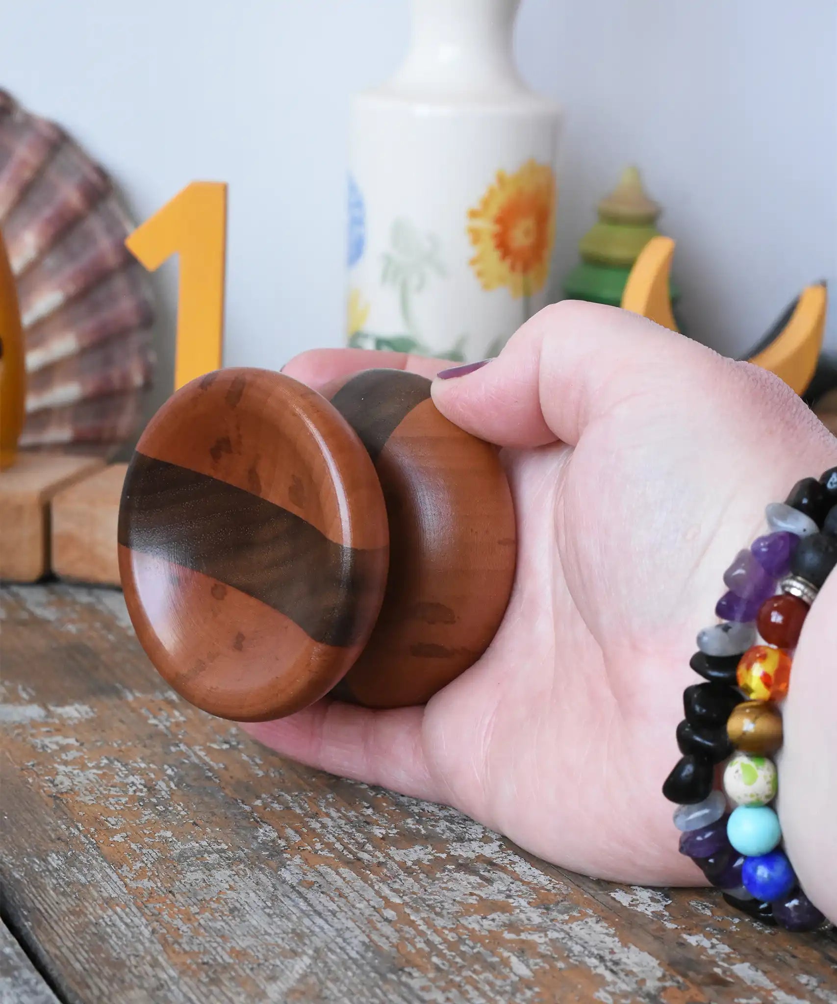 Mader free wheel butterfly yoyo placed in an adult hand. 