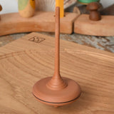 Mader ibis spinning top spinning on an oak spinning plate in the Babipur playroom.