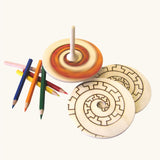 Mader Kreiselmanufaktur Creative Top Set the top is seen blurred while spinning in motion. 