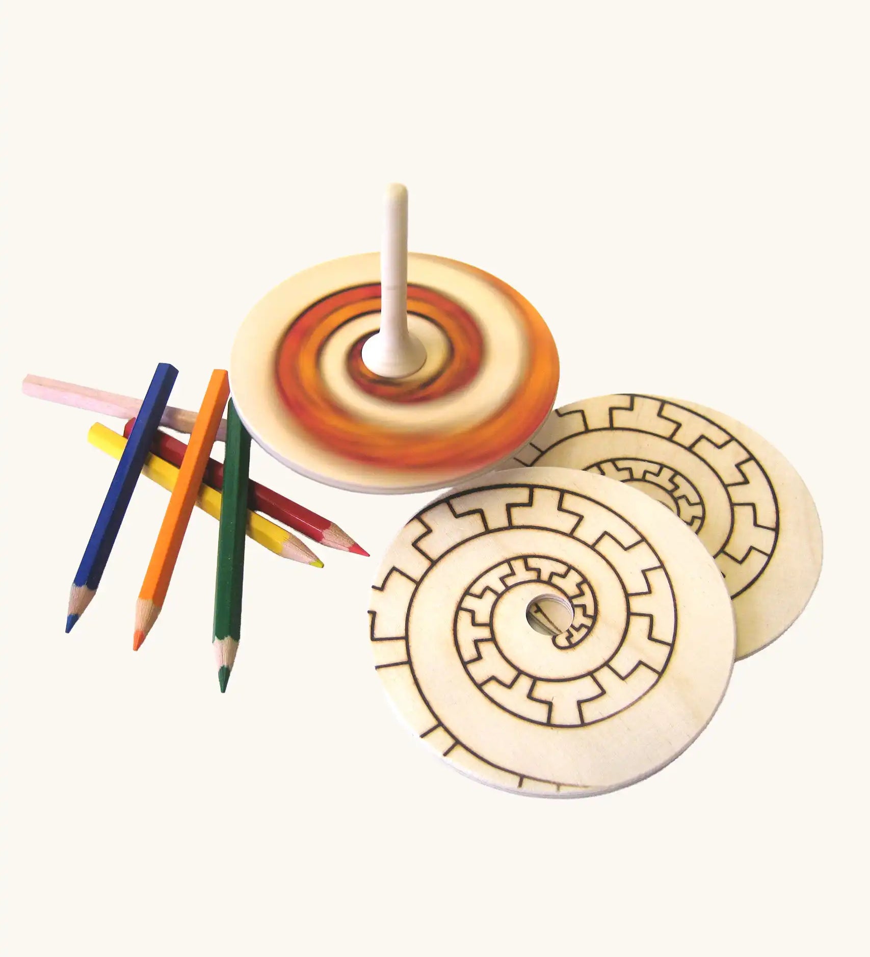 Mader Kreiselmanufaktur Creative Top Set the top is seen blurred while spinning in motion. 