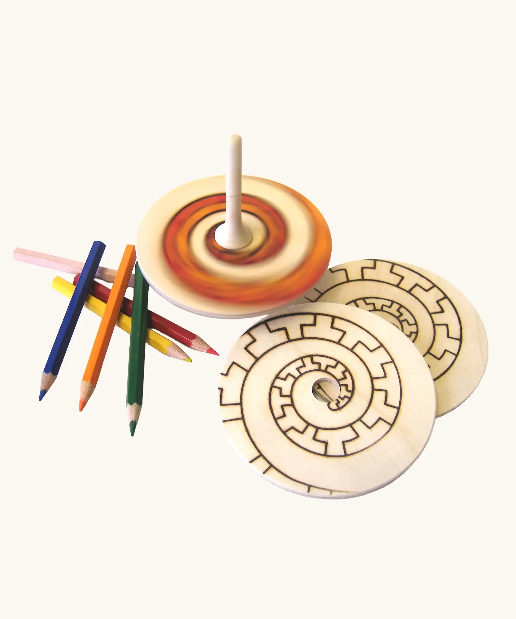 Mader Kreiselmanufaktur Creative Top Set the top is seen blurred while spinning in motion. 