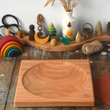 Mader Kreiselmanufaktur Large 25cm Cherry wood Spinning Plate placed on a wooden surface in the Babipur playroom.