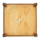 Two Mader plastic-free spinning tops spinning on a Mader 40cm hand carved wooden Manege Spinning Plate