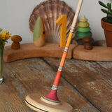 Mader Kreiselmanufaktur large Arabella spinning top placed on a wooden surface in the Babipur playroom. 