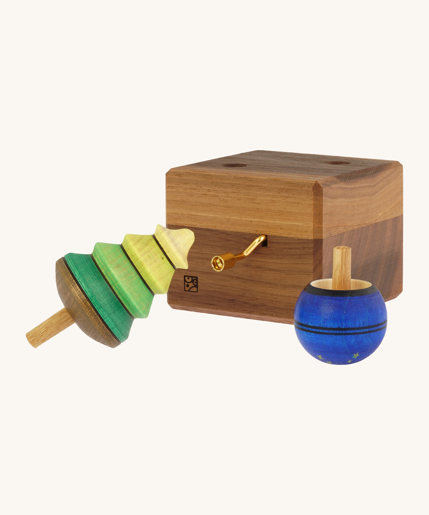 The Mader Luna music box hand made from walnut wood, with two spinning tops.