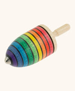 Mader handcrafted wooden rainbow mini thunderbolt spinning top with a magnet underside