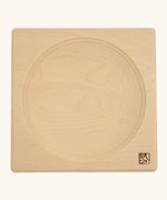 Mader handcrafted maple square medium spinning top plate. Showing the logo on the bottom corner