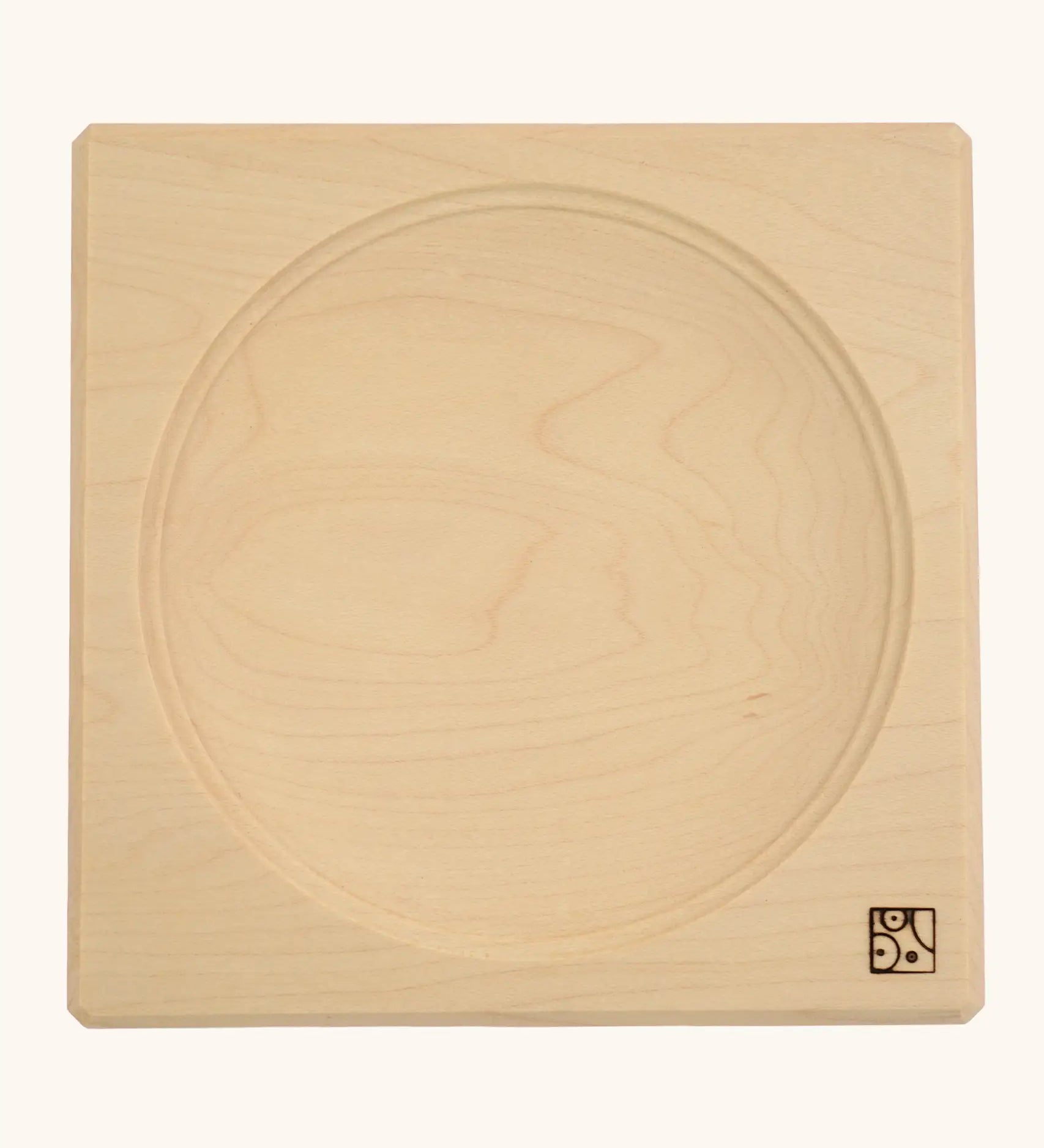 Mader handcrafted maple square medium spinning top plate. Showing the logo on the bottom corner