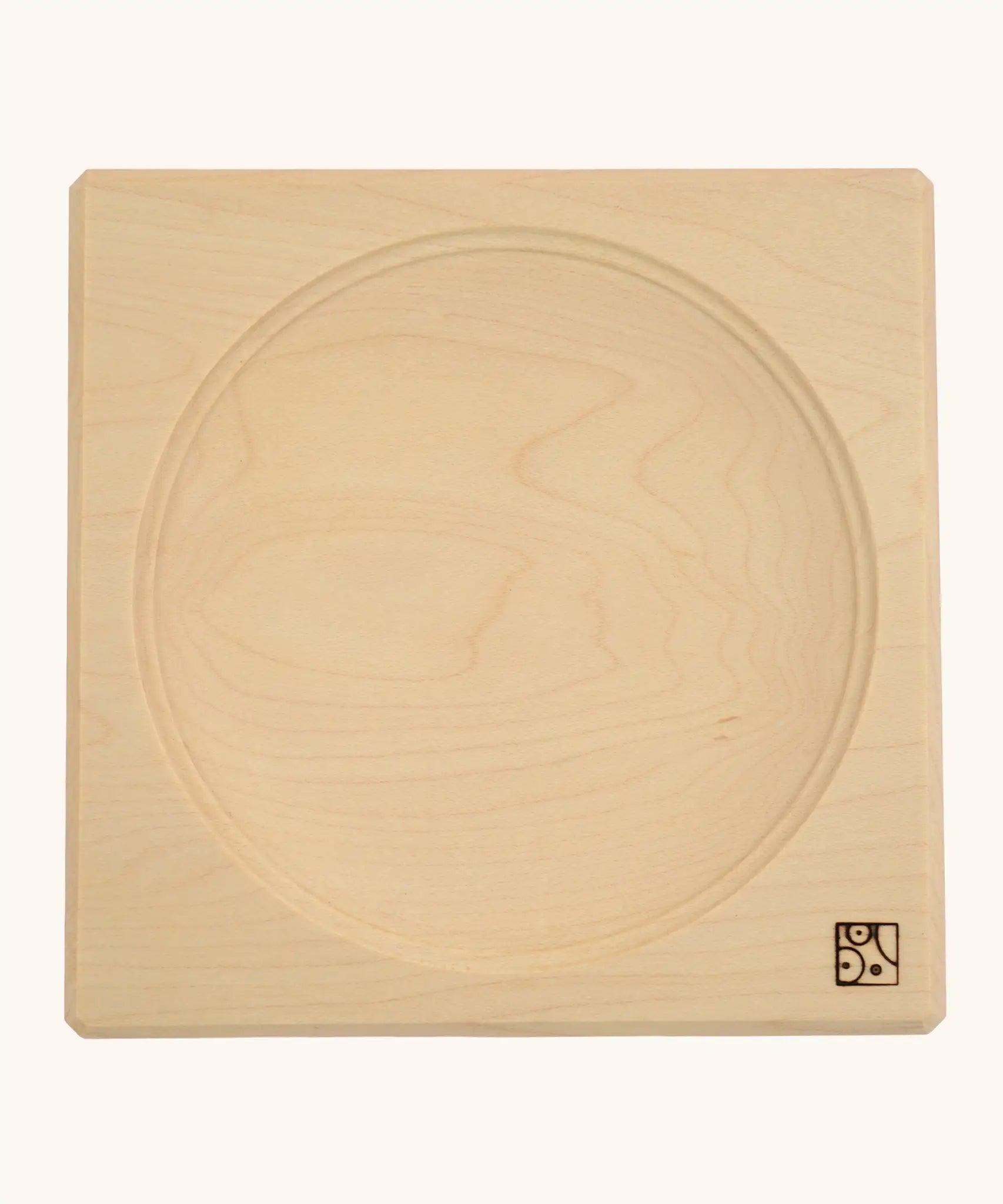 Mader handcrafted maple square medium spinning top plate. Showing the logo on the bottom corner