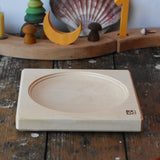 Mader maple medium wooden spinning plate 15cm placed on a wooden surface in the Babipur playroom.