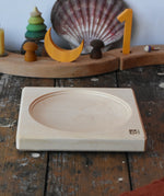 Mader maple medium wooden spinning plate 15cm placed on a wooden surface in the Babipur playroom.